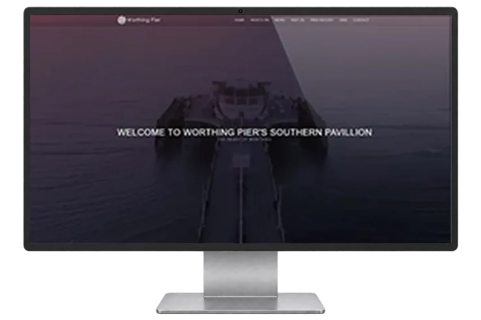 Worthing Pier website shown on a modern desktop monitor