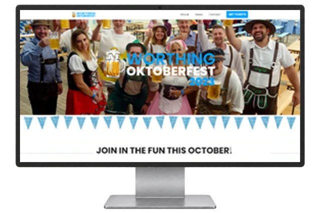 Worthing Oktoberfest website shown on a modern desktop monitor